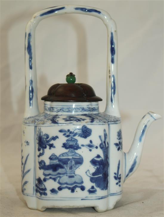 A Chinese blue and white wine pot, Kangxi period, 19cm, restorations